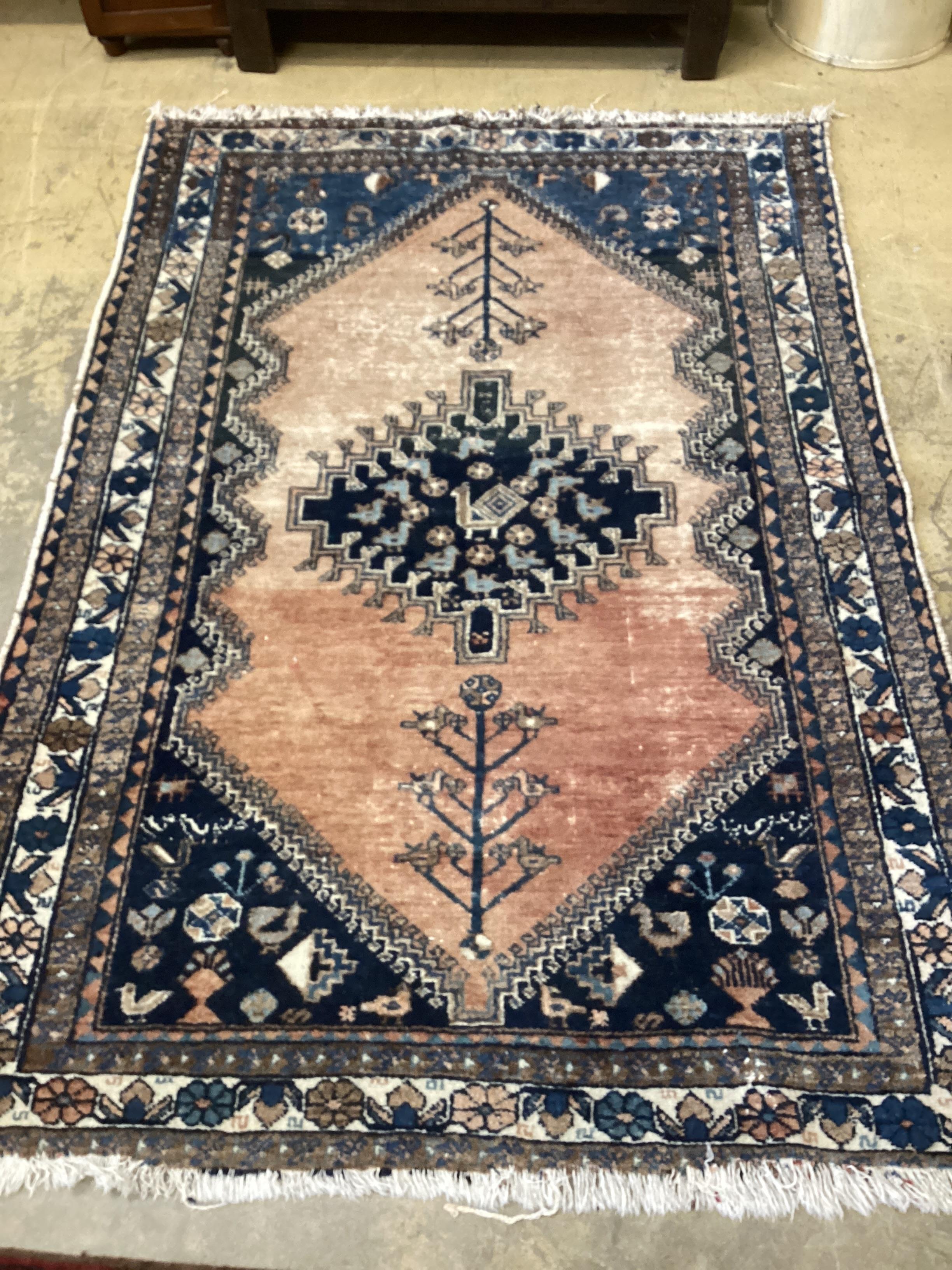 A Caucasian red ground rug, 194 x 136cm